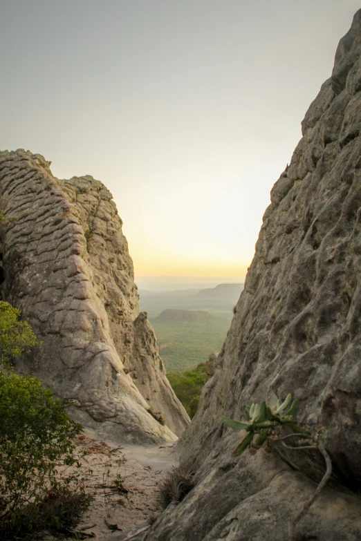 a couple of people ride down some steep mountains