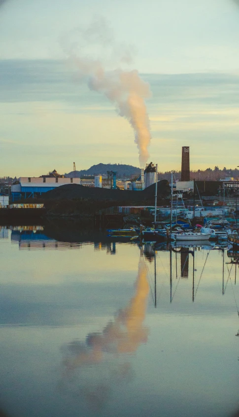 a boat on water with smoke coming from it