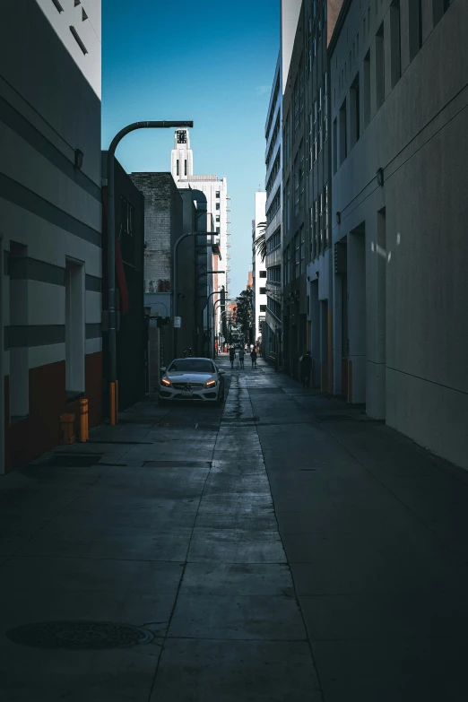 a quiet street filled with cars on it