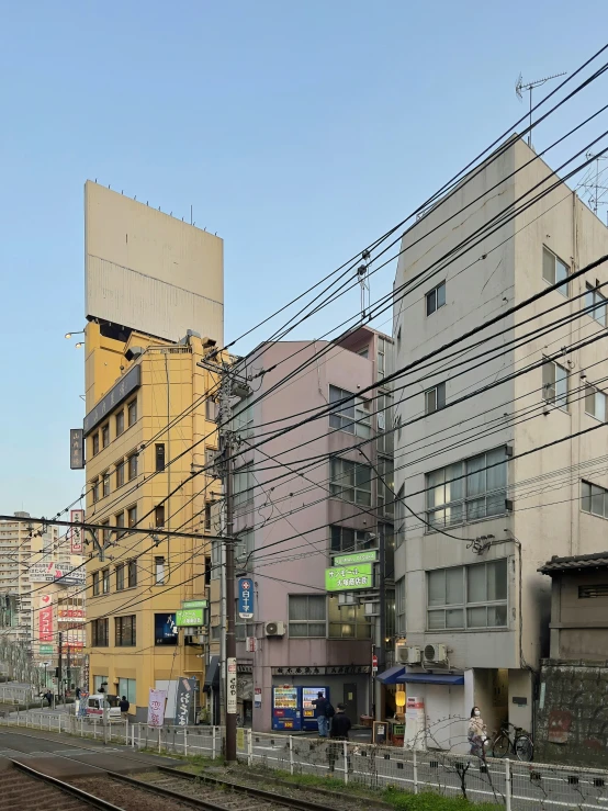 power lines above a train track on a city street