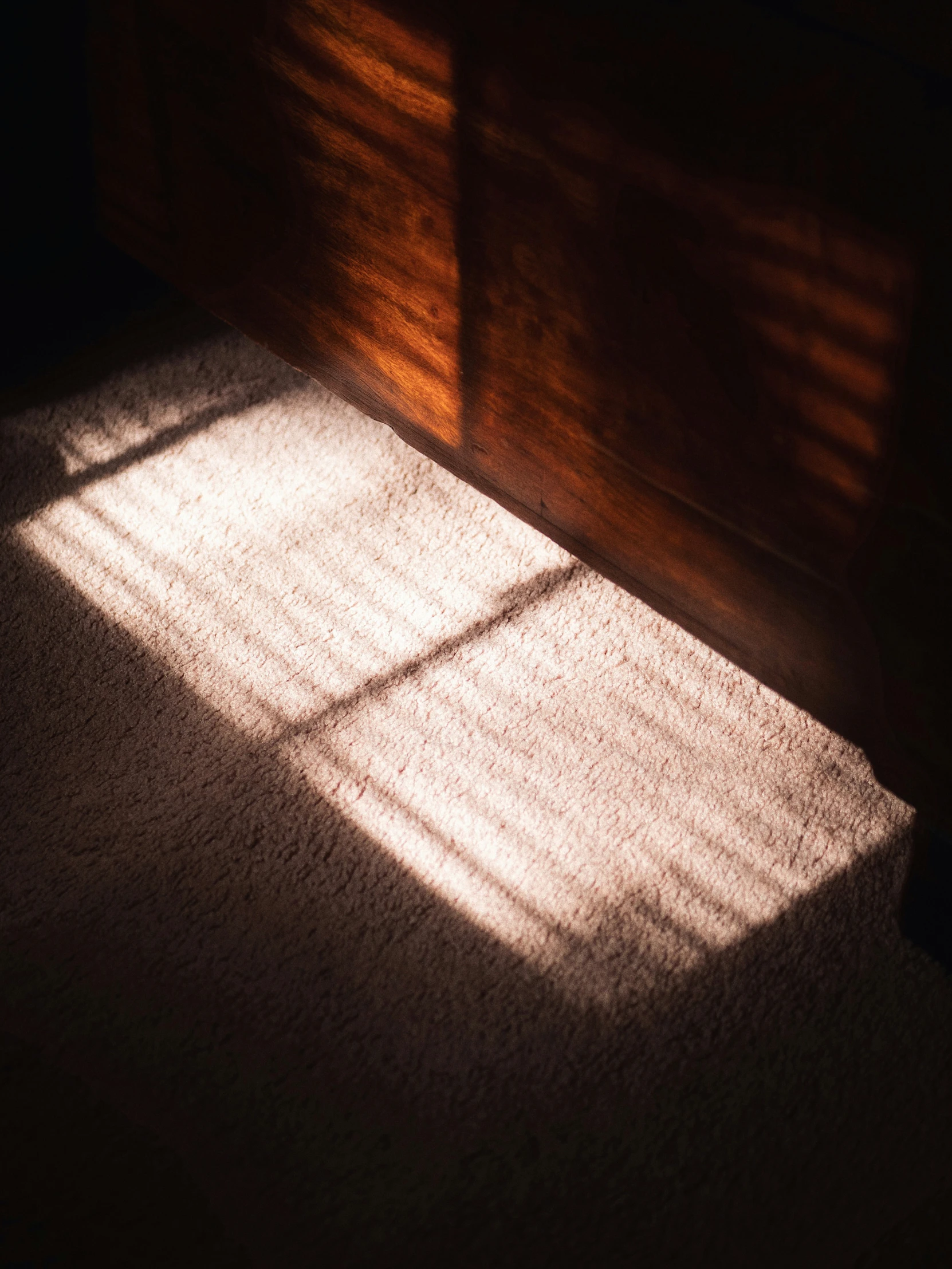 the sunlight is shining through the bedroom window and onto the bed