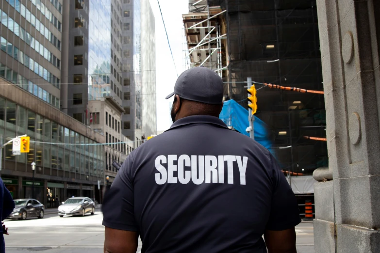 security officer on the street in front of a large building