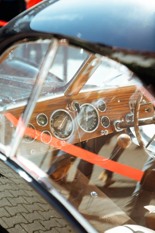 view of a cockpit, dashboard and steering wheel from the drivers perspective