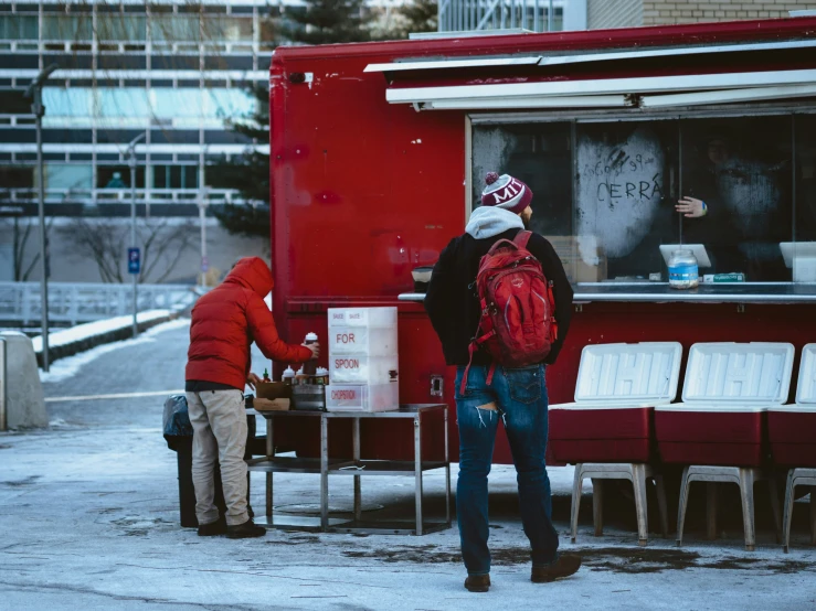 two men getting lunch at a food truck