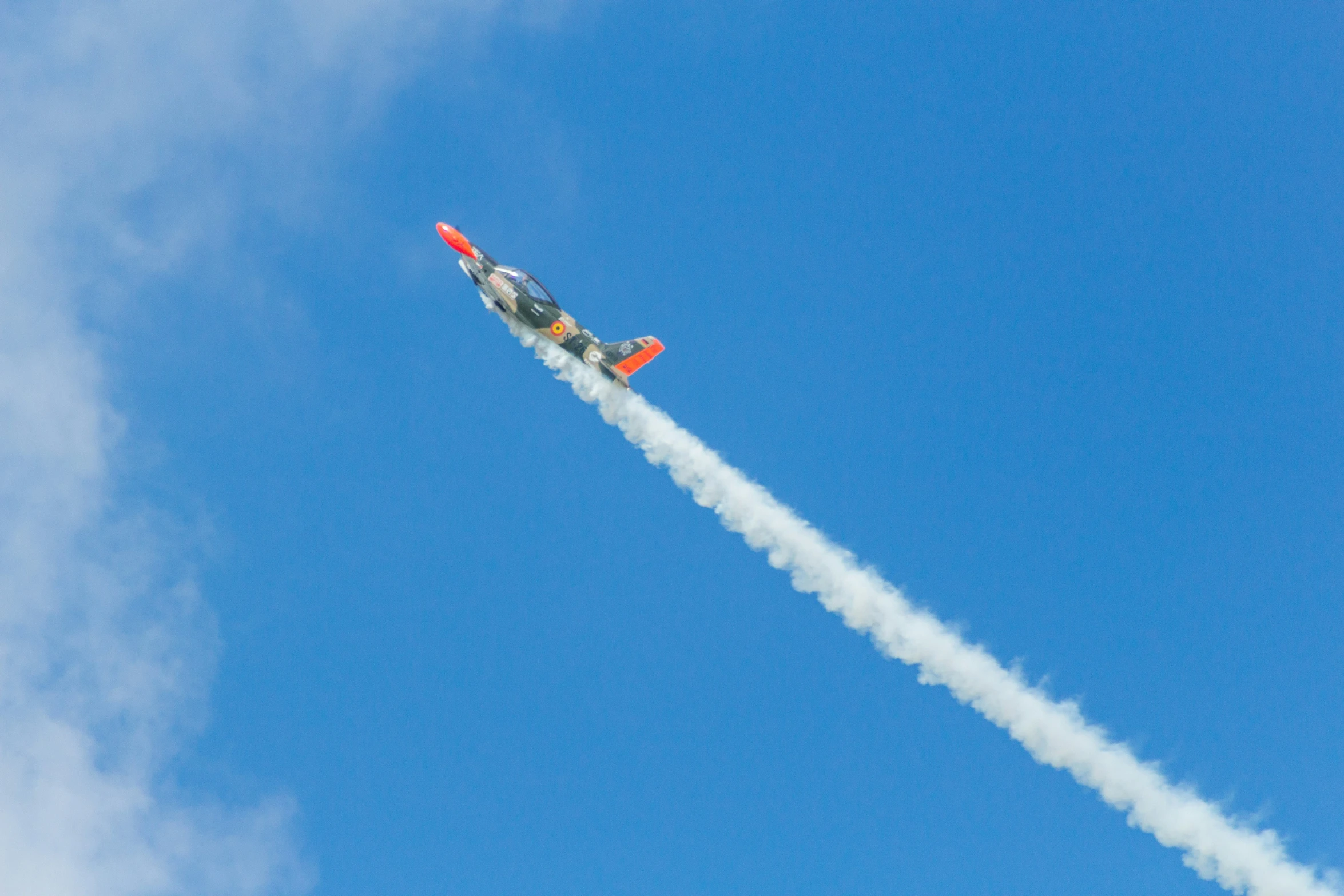 a small plane is flying through the air