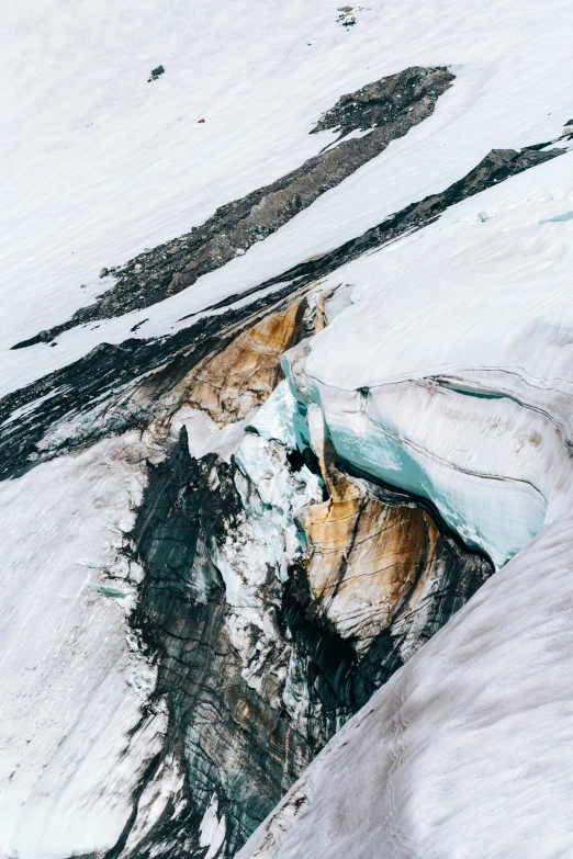 a very long glacier in the mountains in winter