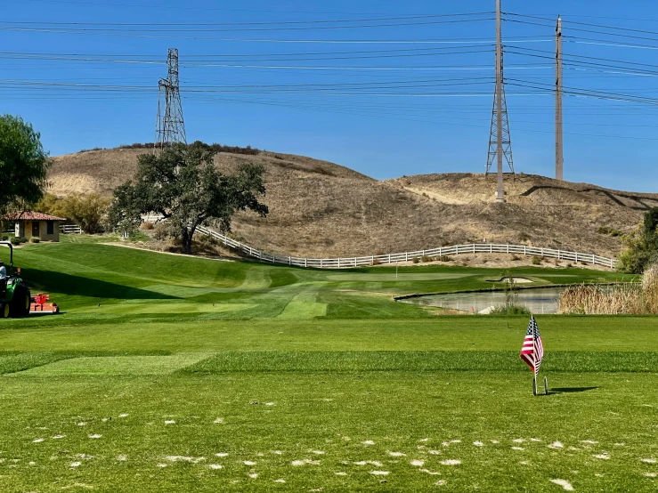 view from golf course with mountains in the background