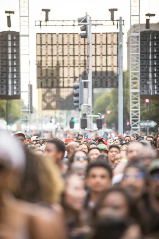 a crowd of people standing outside a large building