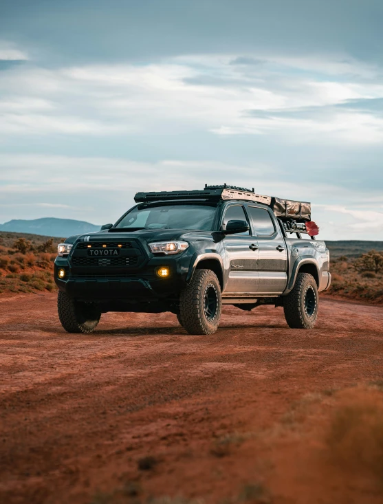 a big truck with two racks of luggage on it's roof