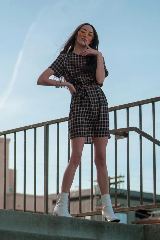 a woman standing on the steps of a building