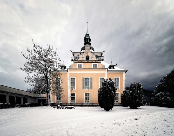 an ornate building with some trees near by