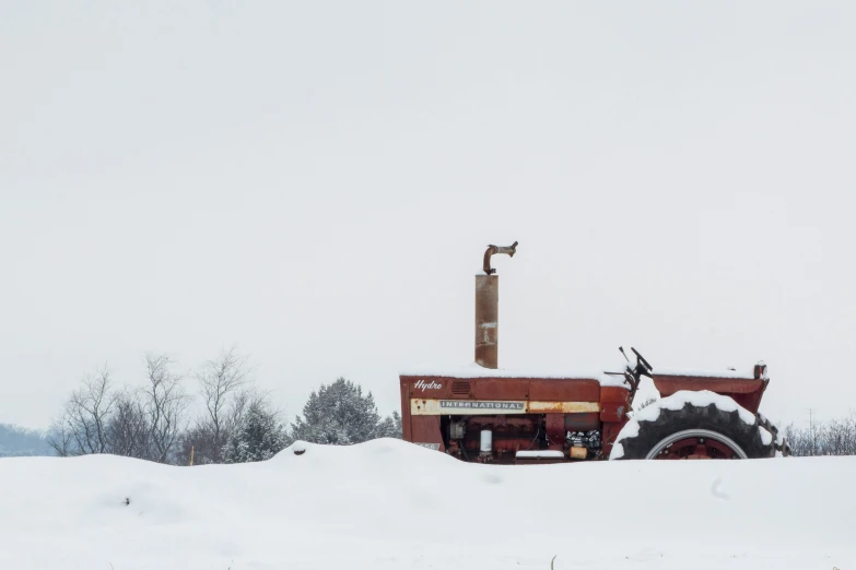 a tractor trailer buried in the snow in the snow