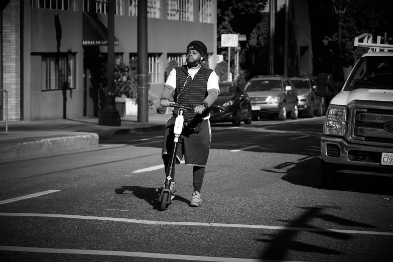 a man on a bike is going down the street