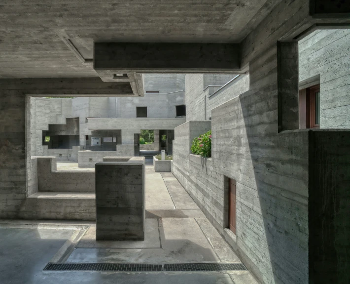 an empty room with concrete blocks as walls