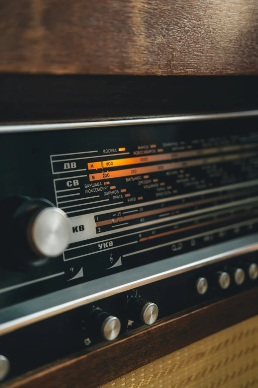 an old radio sitting on top of a wooden stand