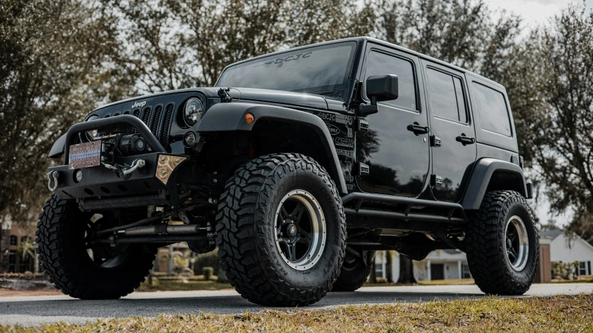 this suv has big tires and is dark black