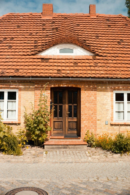 a house with a red roof and windows