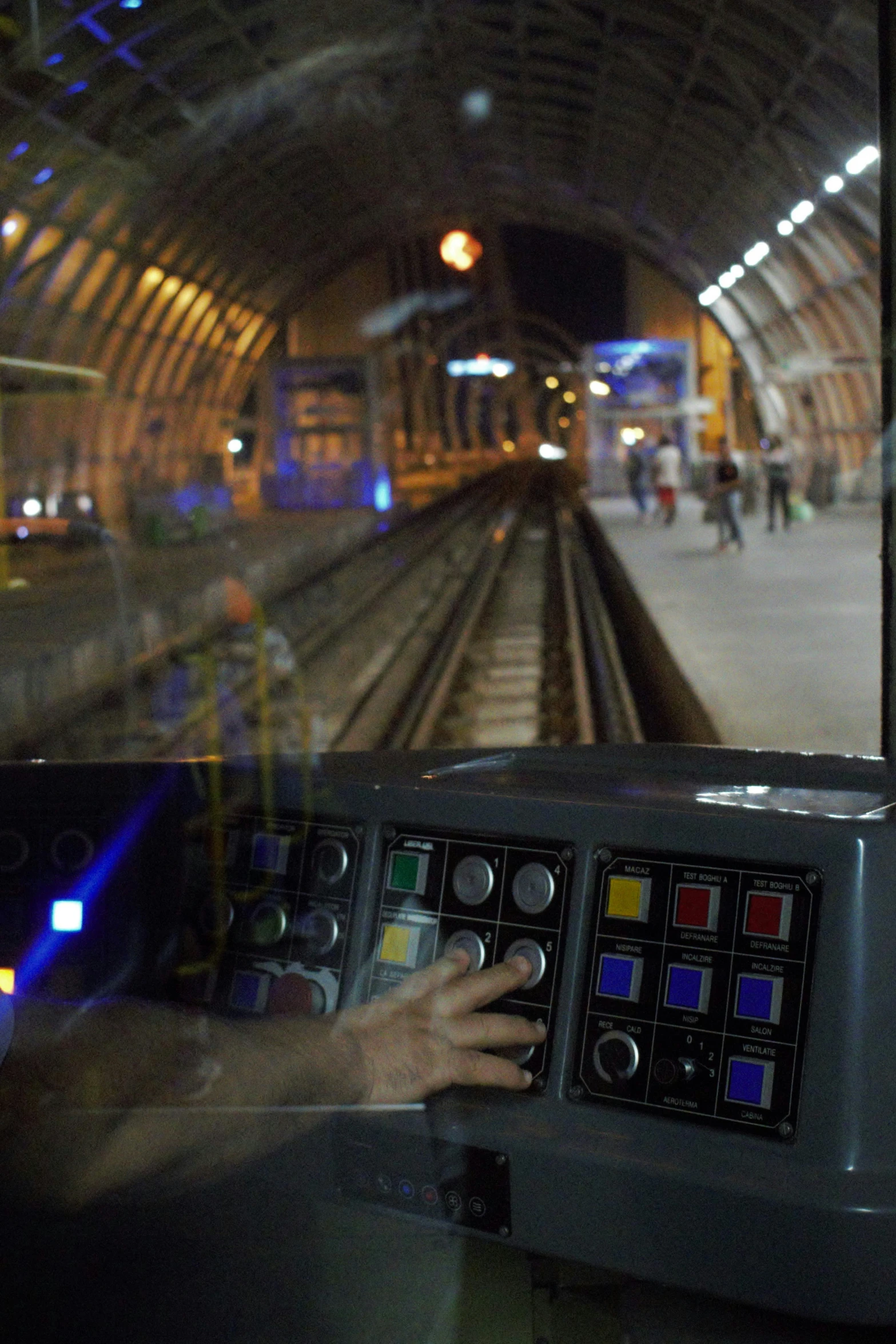 a person touching a display in a passenger car