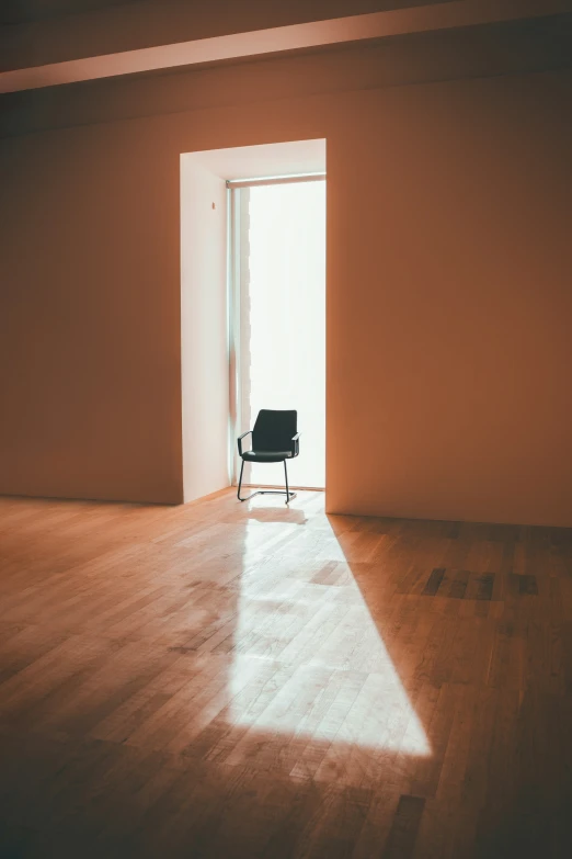 a chair sitting in front of a sliding glass door