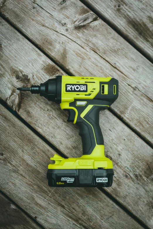 a cordless drill on a wooden surface