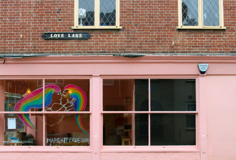 a window that is pink in the day light