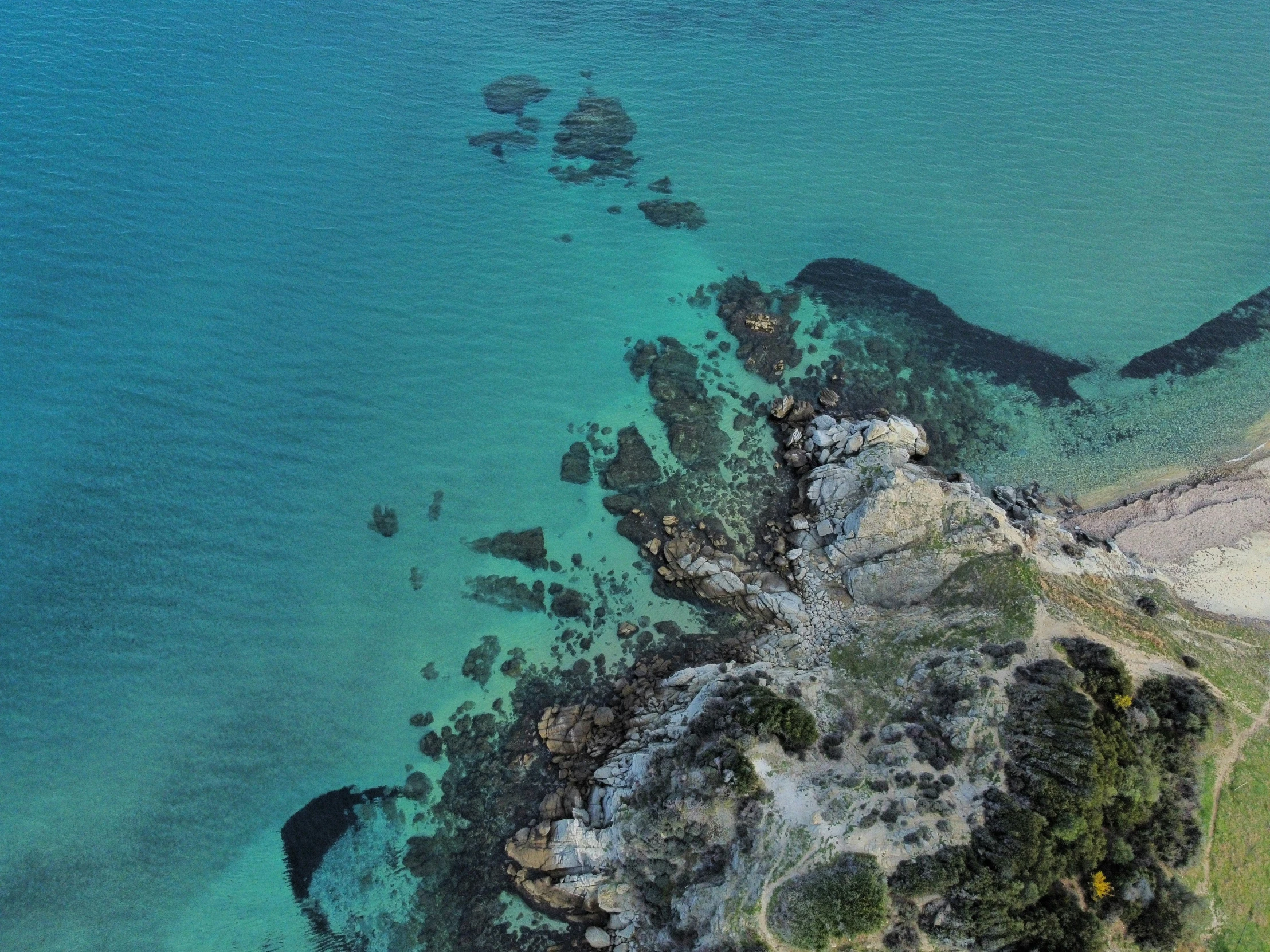 an aerial view of an area near a body of water