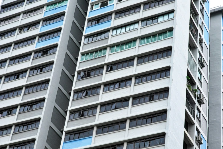 an image of some buildings with windows in the daytime