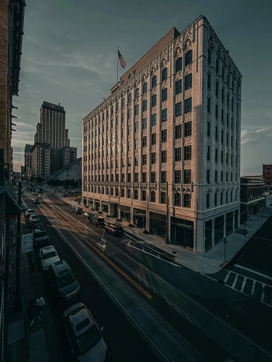 a dark po of a large building in the middle of an urban area