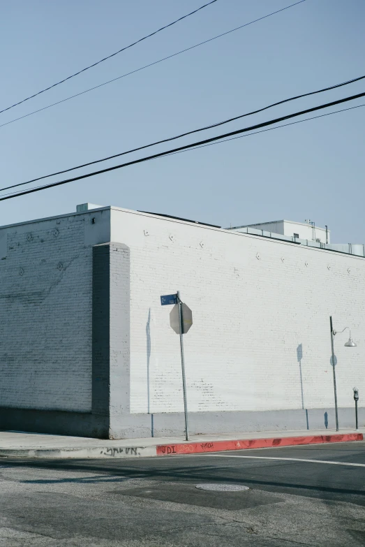 white building next to street and telephone wires