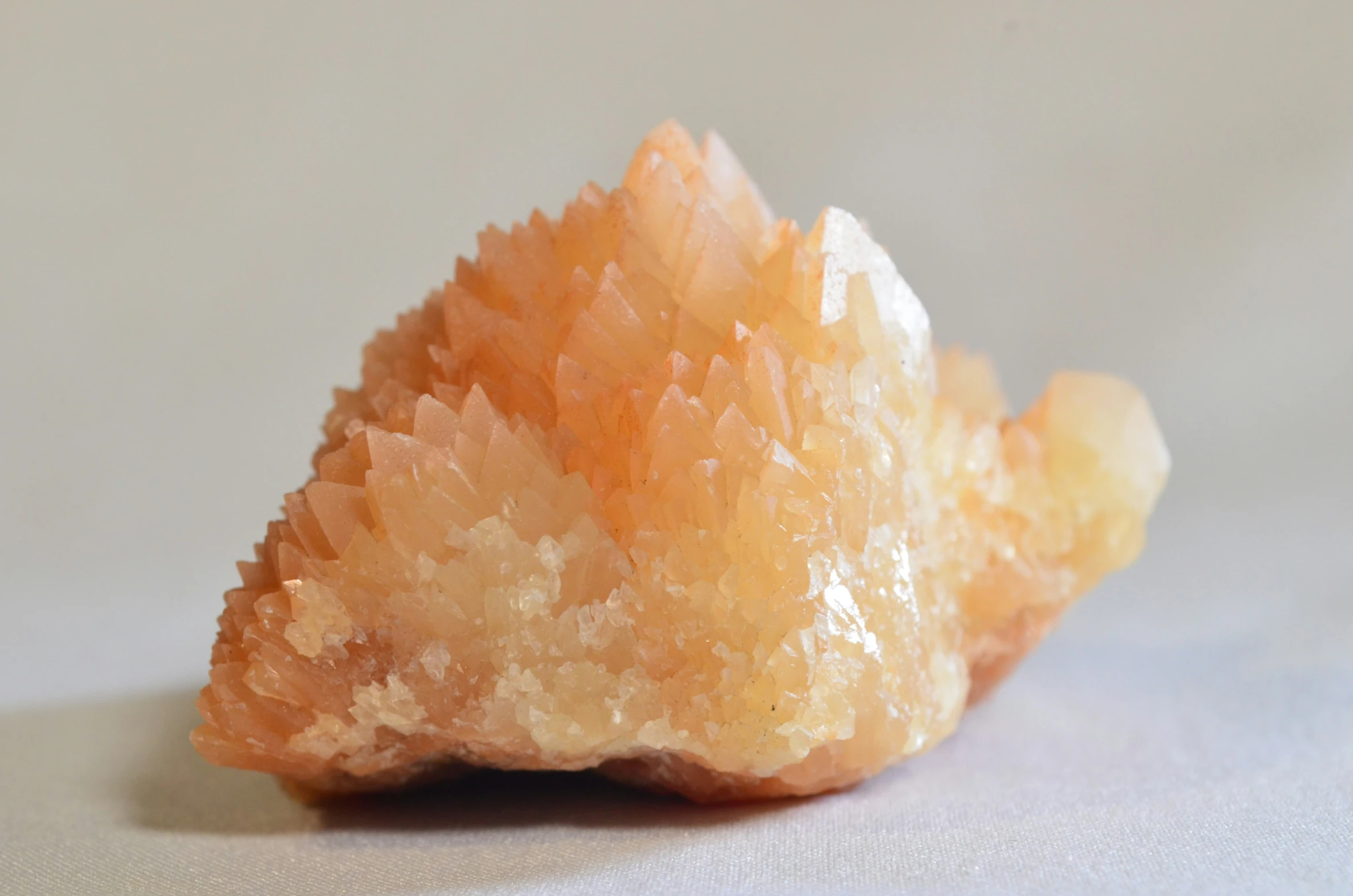 some sort of orange colored mineral on top of white table