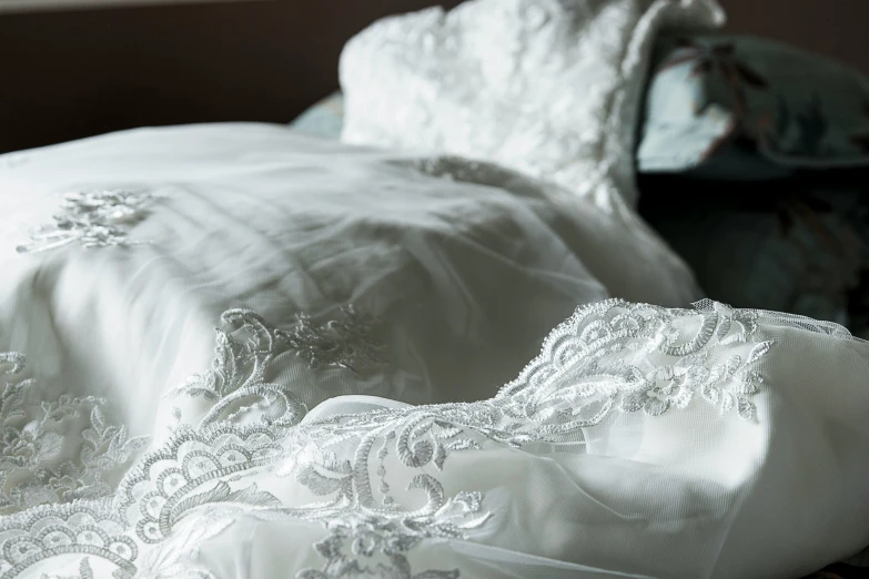 the comforter has been made to look like a wedding gown