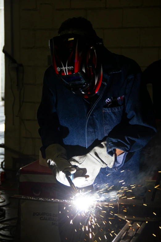 a person working on some kind of machinery with sparklers