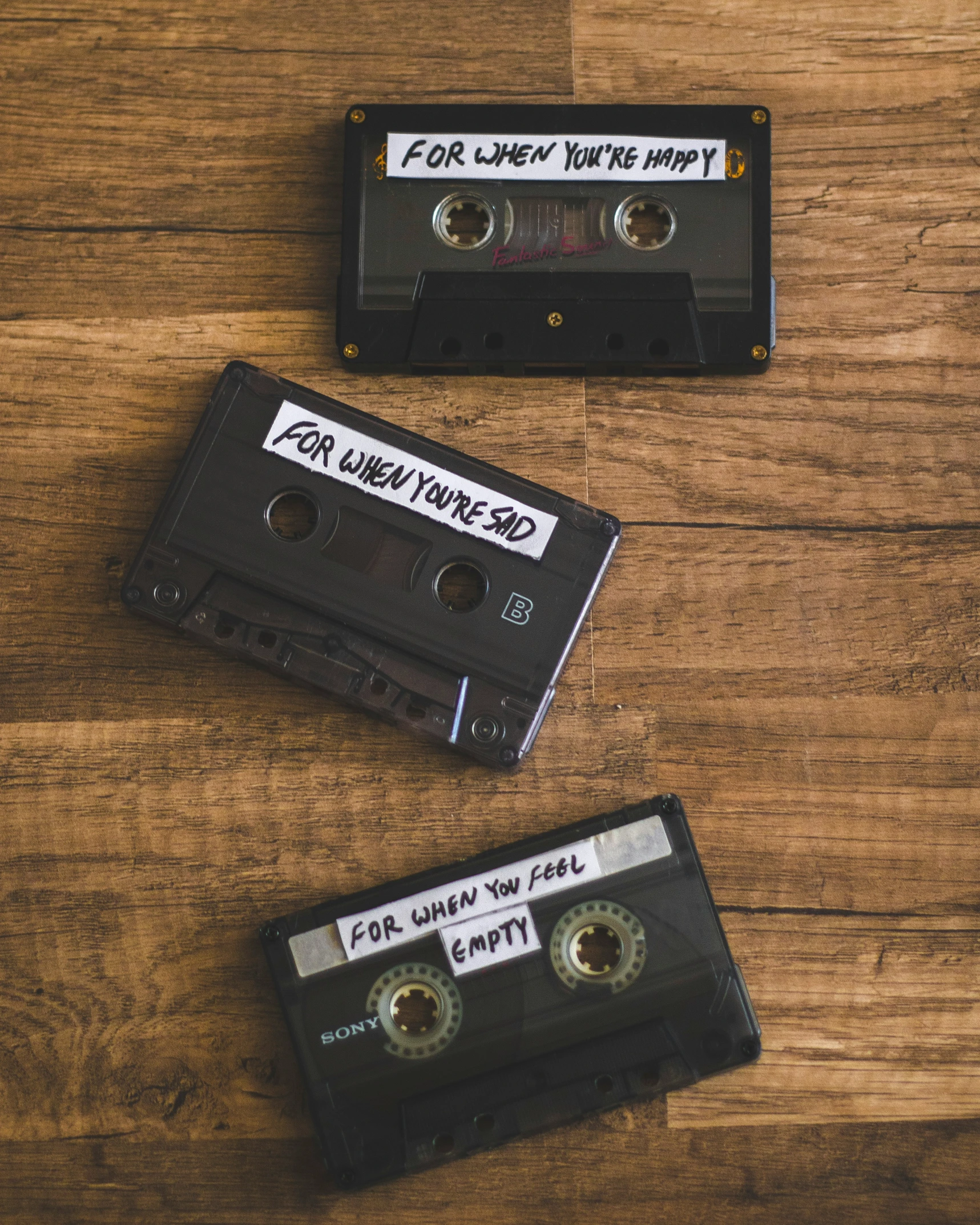 two personalized audio cassettes sitting on a table