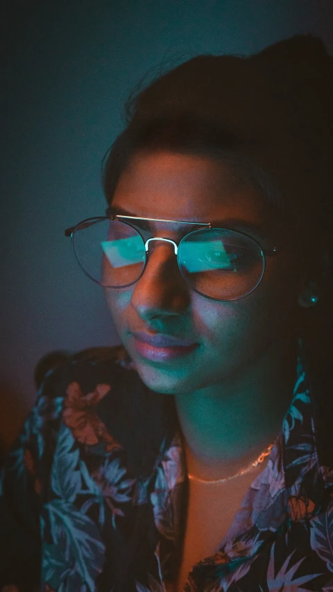 man wearing colorful glasses posing for a picture