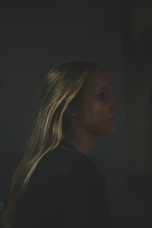 a woman with long hair staring back