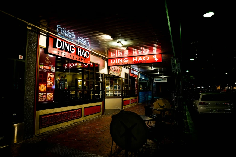 a street corner has neon lights on the front