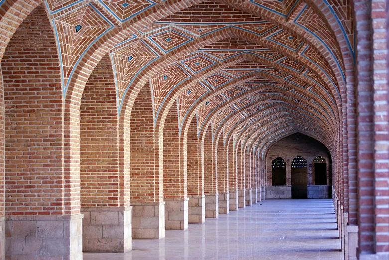 the columns in the walkway are covered with tile