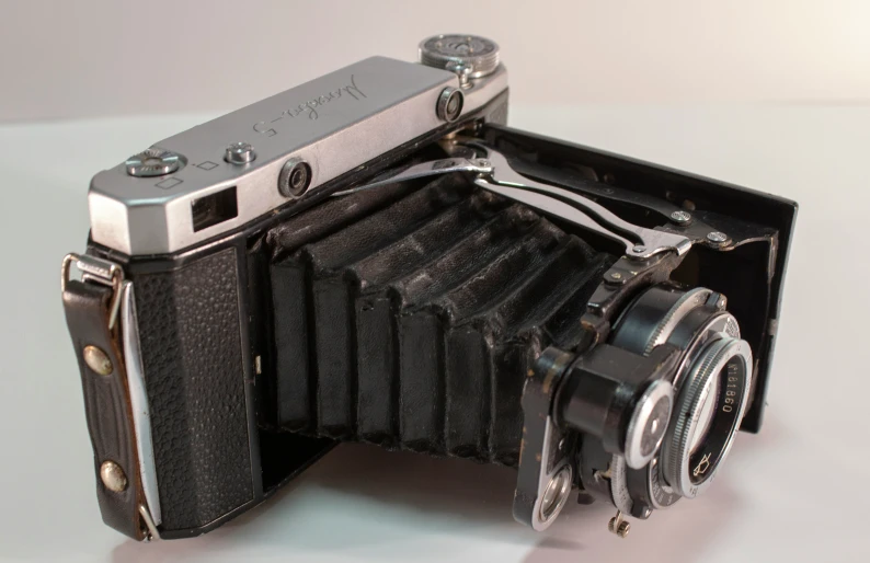 an old camera sitting on top of a table