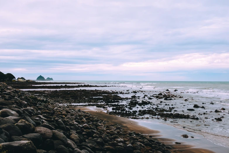 the view from the ocean at low tide with rocks