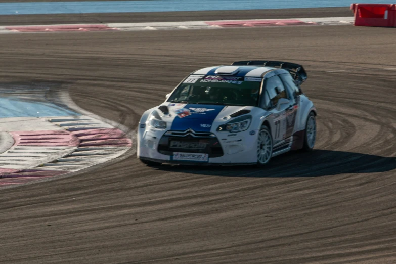 a citroen car racing around the corner