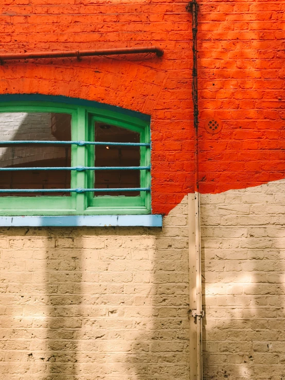 a window on the side of a brick building