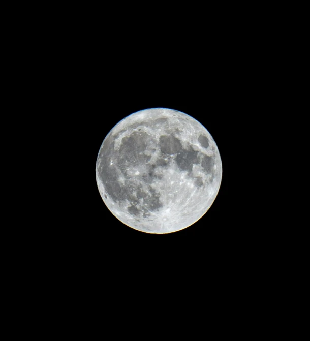 a very full moon in the middle of the night