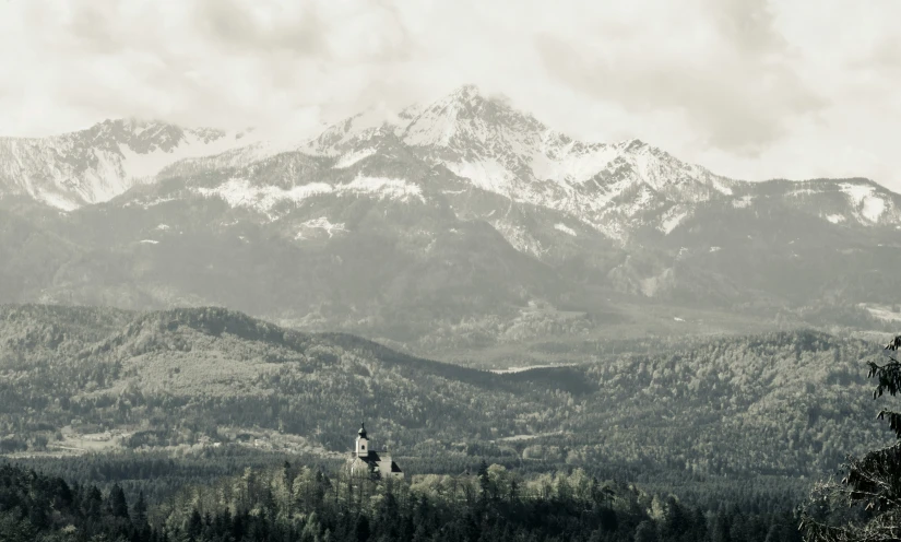 a distant po with trees on the hillside