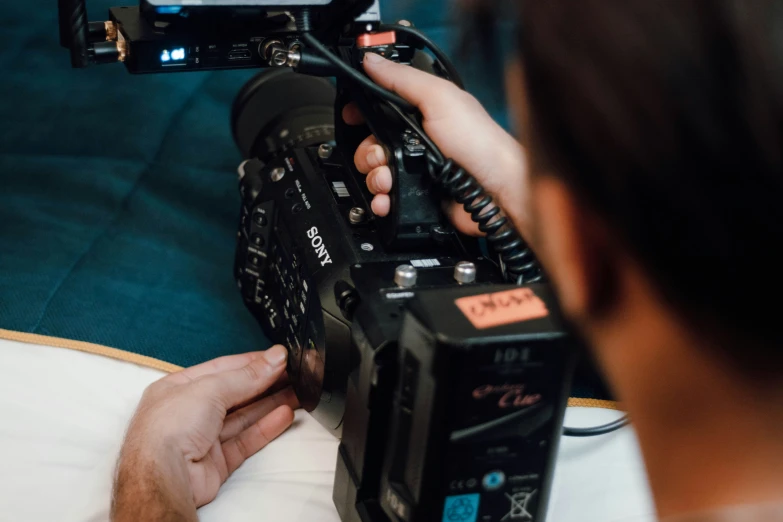 a man that is sitting down with a camera