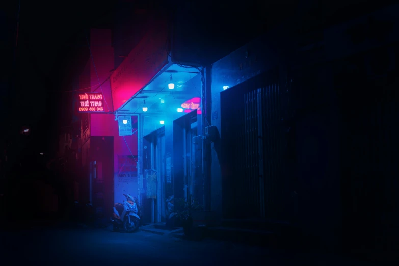 neon signs lit up on the side of buildings