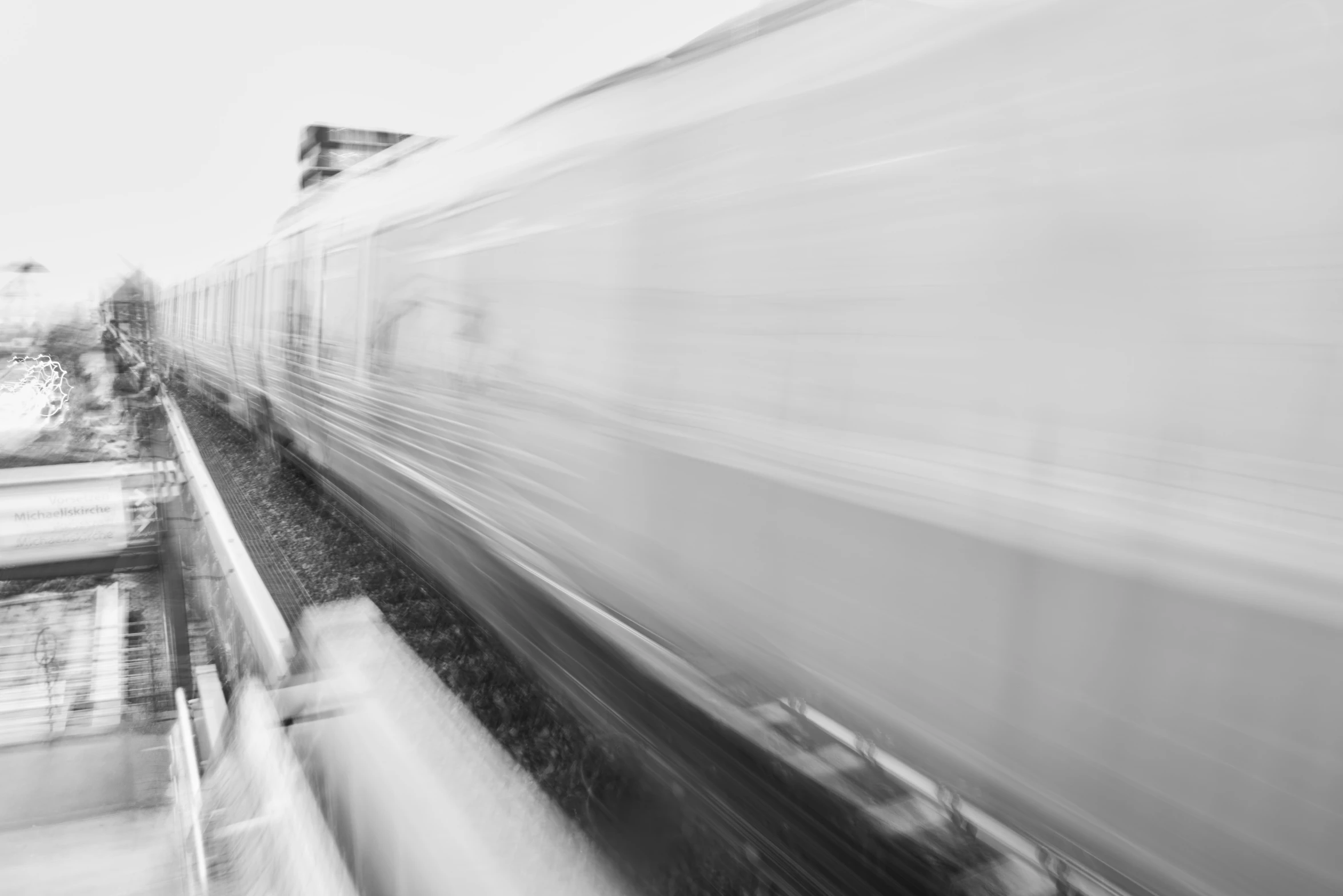 a train going by in black and white