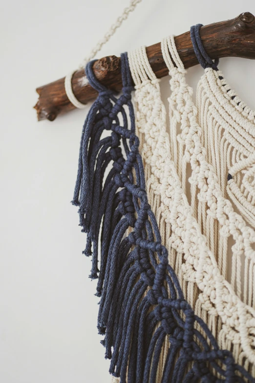 an antique woven and rope weaving project with wooden handles