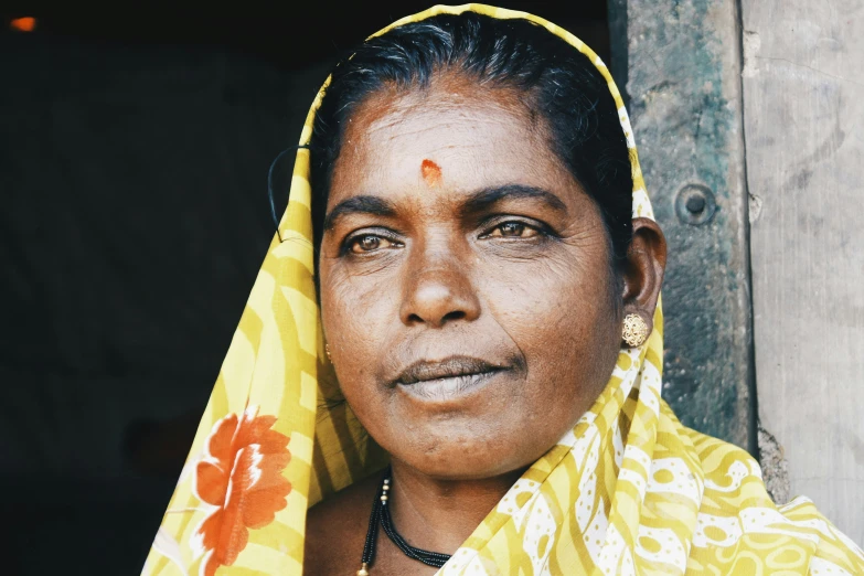 the woman is wearing an indian sari