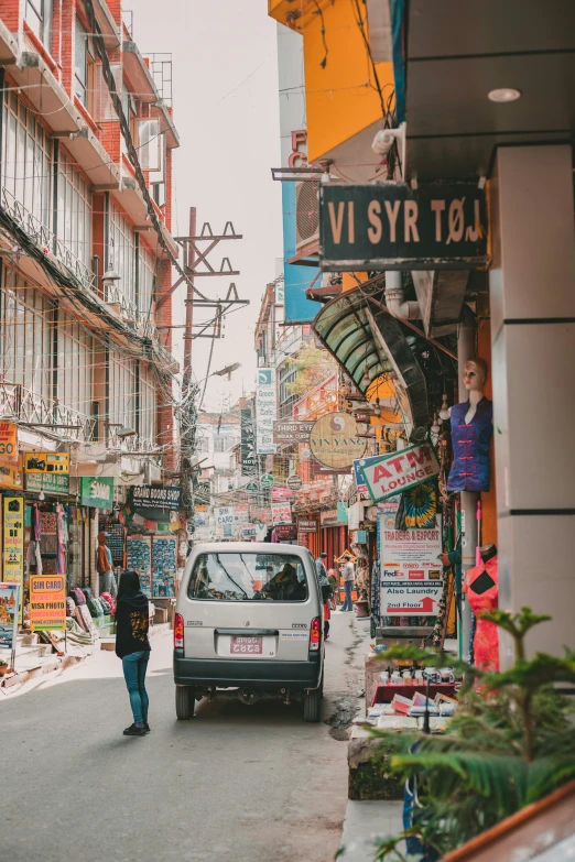 the back side of a street with a man walking behind it