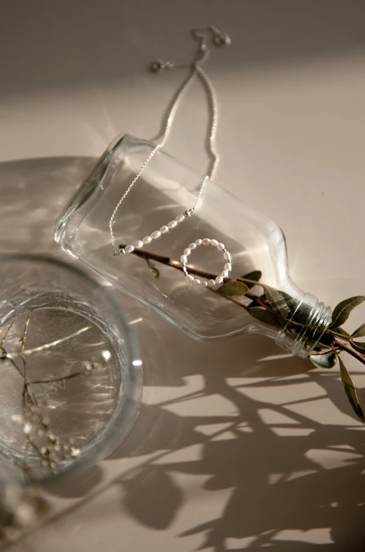 a single flower sitting in a vase sitting on a table